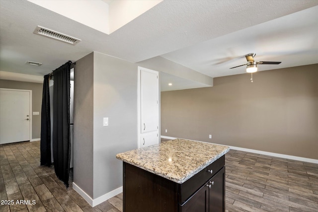 6743 S Jentilly Ln, Tempe, AZ 85283 - kitchen with visible vents, baseboards, ceiling fan, and dark wood-style floors