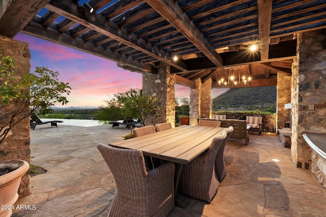 patio terrace at dusk with a pergola