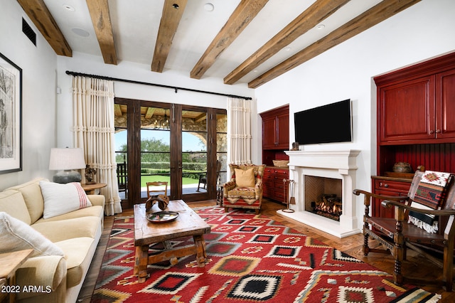 living room featuring french doors, beamed ceiling, and hardwood / wood-style flooring