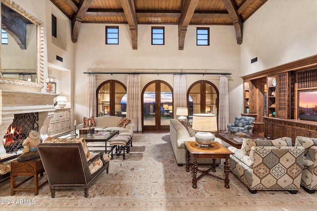 living room with wooden ceiling, a premium fireplace, french doors, beam ceiling, and high vaulted ceiling