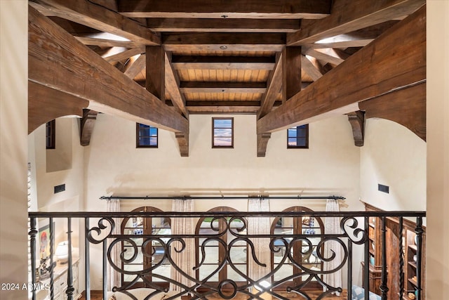 hallway featuring wood ceiling and vaulted ceiling with beams