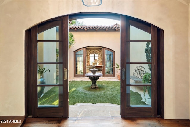 entrance foyer featuring wood-type flooring and french doors