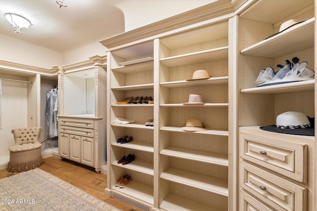 spacious closet featuring light hardwood / wood-style floors