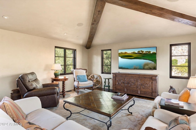 living room featuring beamed ceiling