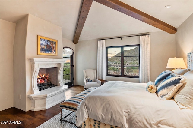 bedroom with dark wood-type flooring and vaulted ceiling with beams