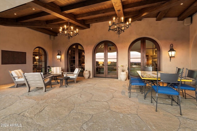 patio terrace at dusk featuring french doors