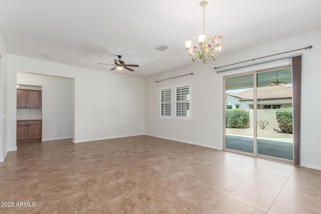unfurnished room with a chandelier, ceiling fan, and baseboards