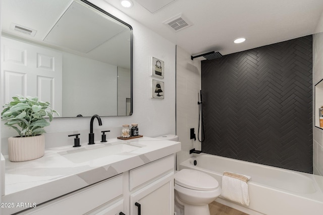 bathroom with toilet, visible vents, tub / shower combination, and vanity