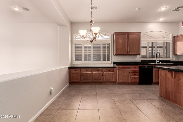 kitchen with dark countertops, visible vents, an inviting chandelier, and dishwasher