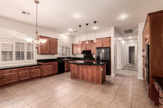 kitchen featuring a kitchen island, black dishwasher, stainless steel refrigerator with ice dispenser, a sink, and light tile patterned floors