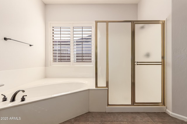 full bathroom with tile patterned floors, a bath, and a shower stall