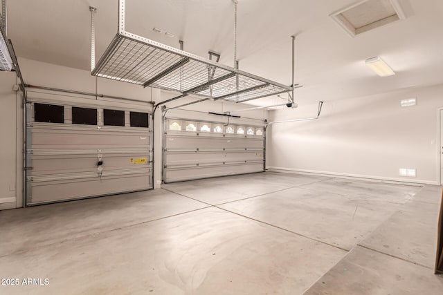 garage featuring baseboards