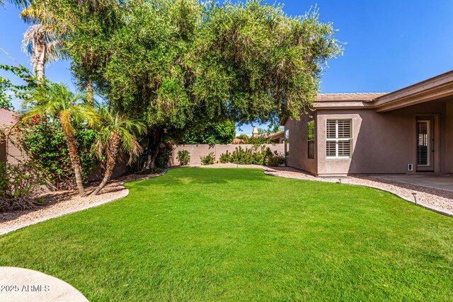 view of yard with a fenced backyard