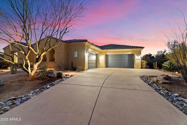 mediterranean / spanish-style home featuring a garage