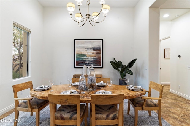 dining space featuring an inviting chandelier