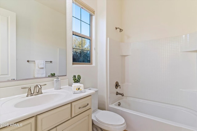 full bathroom with vanity, washtub / shower combination, and toilet