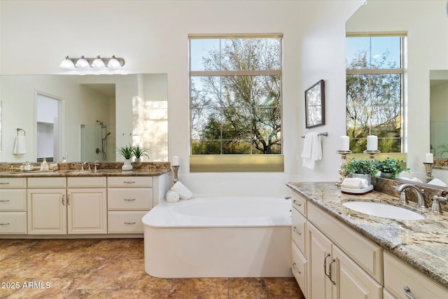 bathroom with plus walk in shower and vanity