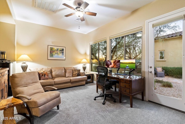 home office with ceiling fan and carpet flooring