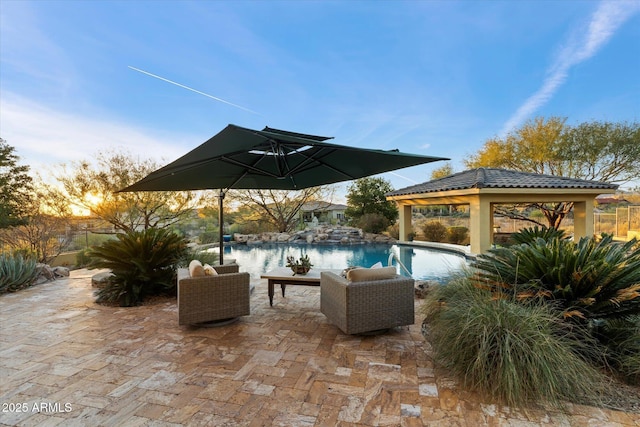 view of patio / terrace featuring an outdoor living space and a gazebo