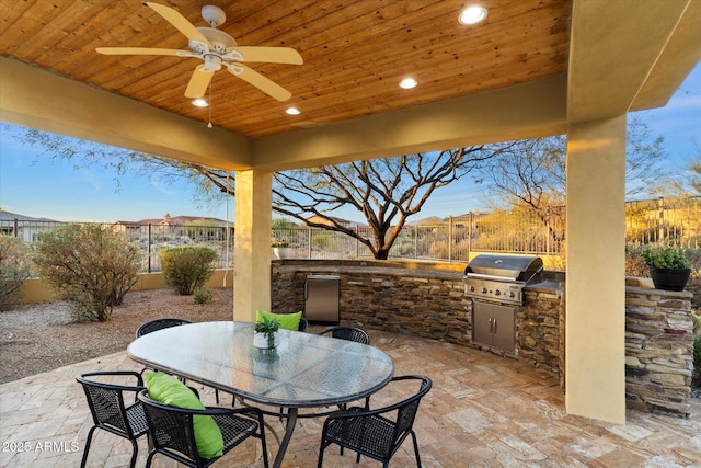 view of patio / terrace with ceiling fan, area for grilling, and grilling area