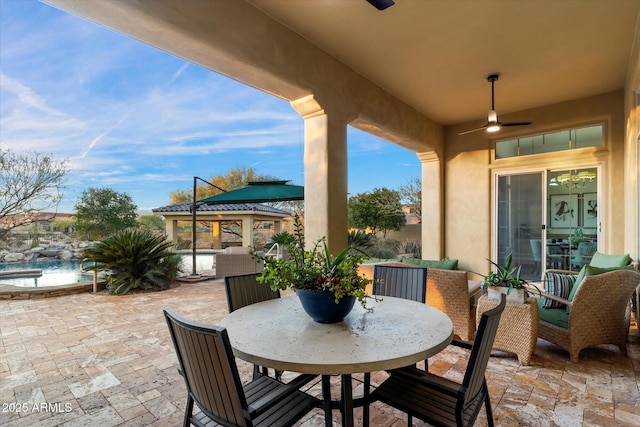 view of patio / terrace with ceiling fan