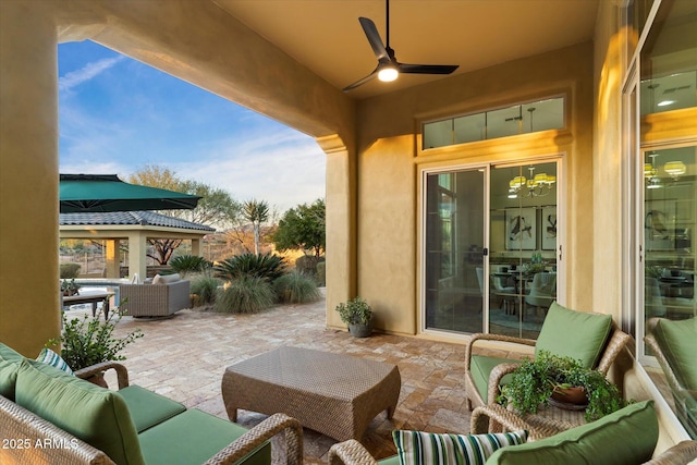 view of patio / terrace with ceiling fan and outdoor lounge area