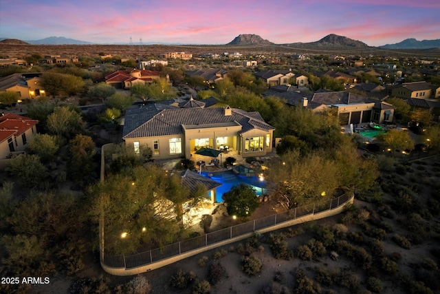 aerial view at dusk with a mountain view