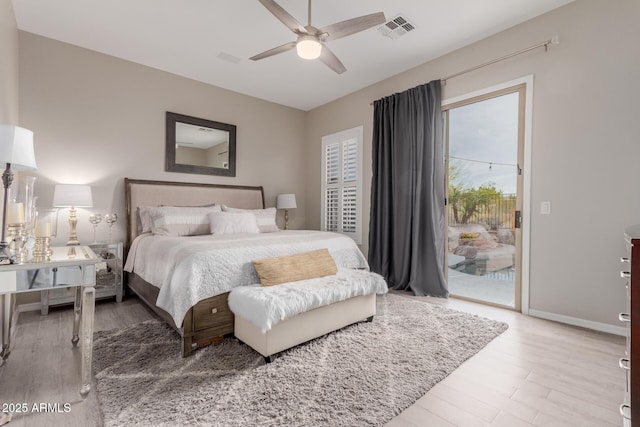 bedroom featuring access to outside, light hardwood / wood-style floors, and ceiling fan