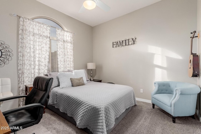 bedroom with ceiling fan and light carpet