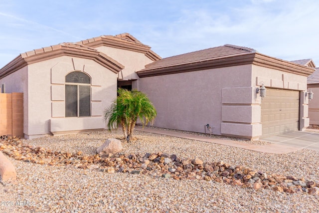 view of side of home featuring a garage