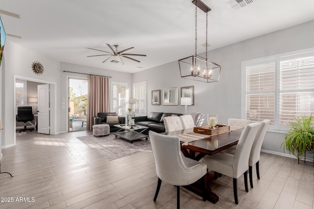 dining space featuring plenty of natural light and ceiling fan