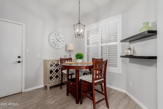 dining area with light hardwood / wood-style floors