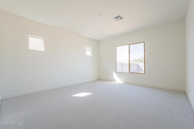 6728 N 190th Dr, Waddell, AZ 85355 - empty room with carpet floors, visible vents, and baseboards