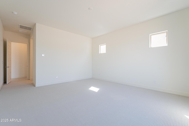 6728 N 190th Dr, Waddell, AZ 85355 - spare room with baseboards, visible vents, and light carpet