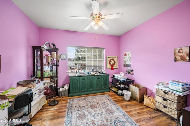 office space with ceiling fan and wood finished floors