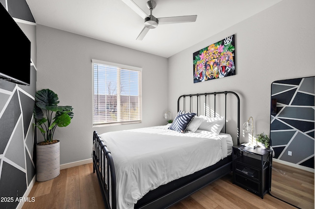 bedroom featuring ceiling fan and wood-type flooring