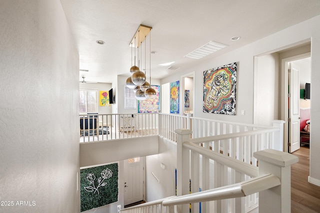 stairs featuring hardwood / wood-style flooring