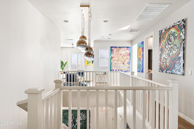 hallway with wood-type flooring