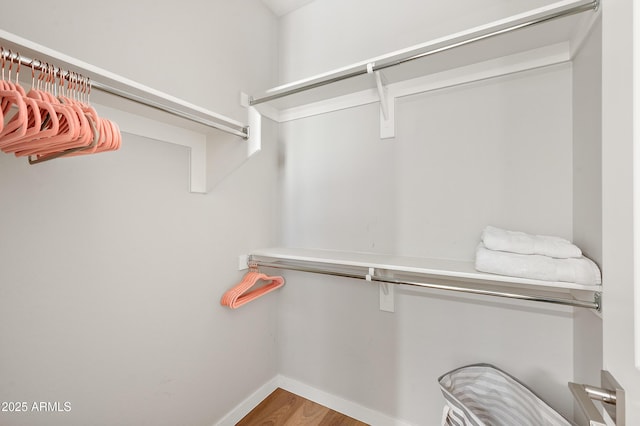 walk in closet featuring hardwood / wood-style floors