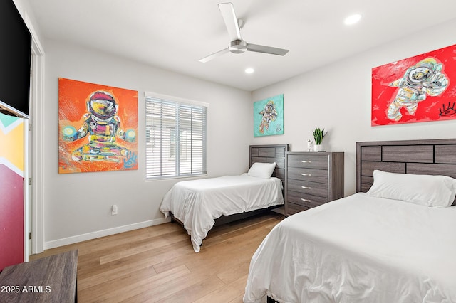 bedroom with ceiling fan and light wood-type flooring