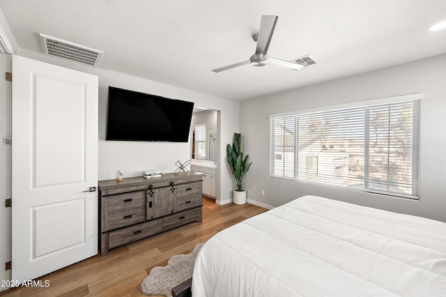 bedroom with ceiling fan and light hardwood / wood-style floors