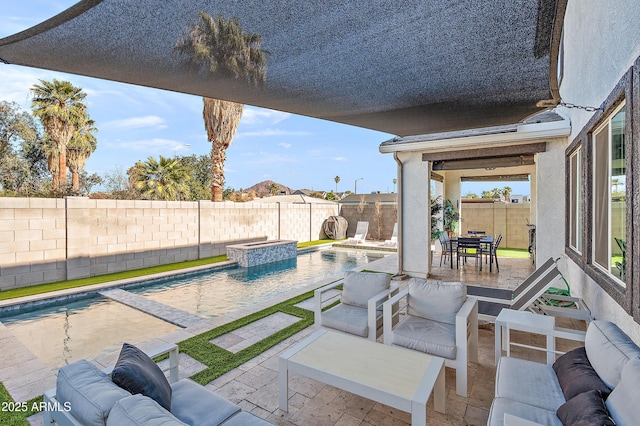 view of pool with an outdoor living space, a jacuzzi, and a patio area