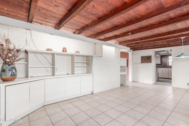 interior space featuring light tile patterned floors, wood ceiling, a ceiling fan, and beamed ceiling