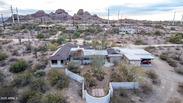 birds eye view of property with a mountain view