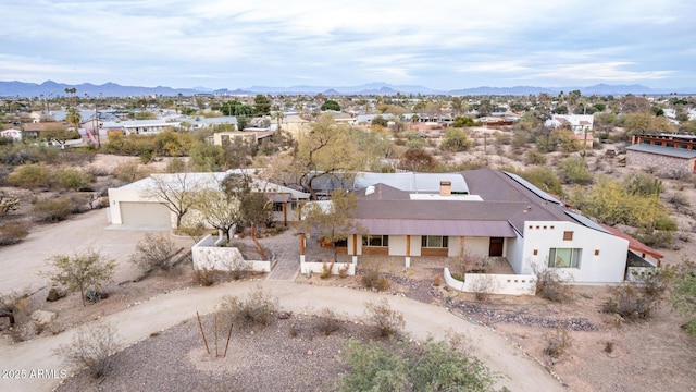 birds eye view of property with a mountain view