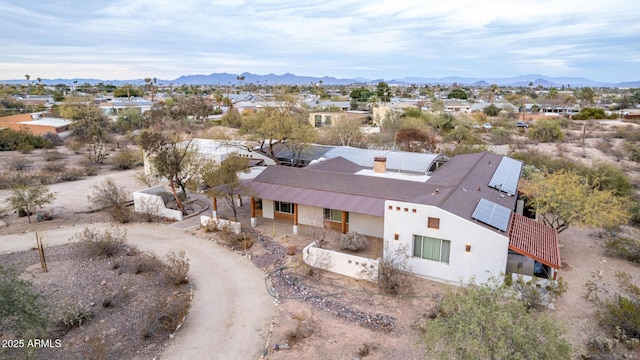 birds eye view of property featuring a mountain view