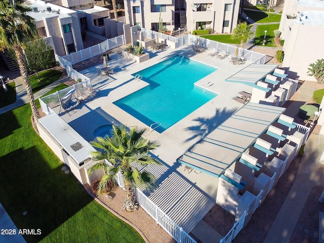 view of swimming pool with a patio