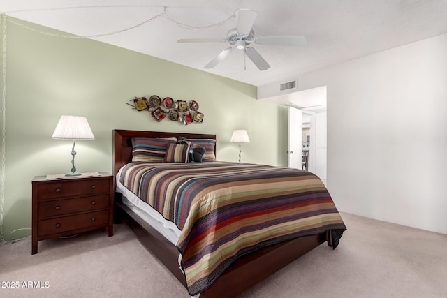 bedroom with light carpet and ceiling fan