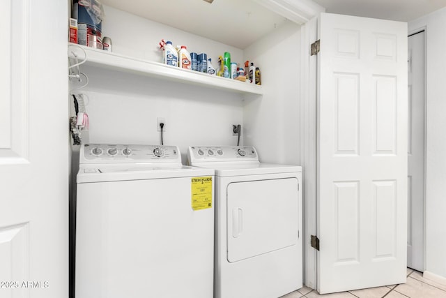 washroom with light tile patterned floors and independent washer and dryer