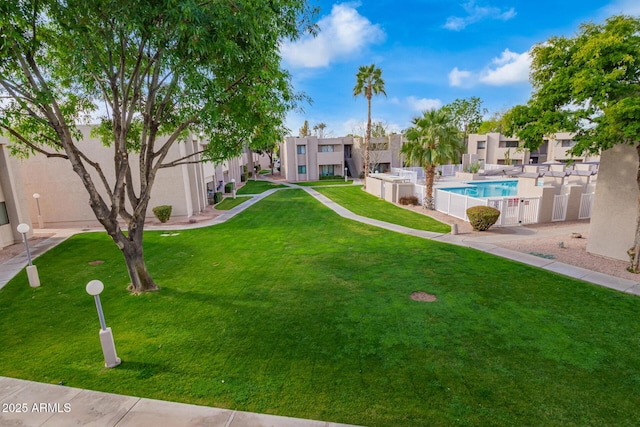 view of yard featuring a fenced in pool